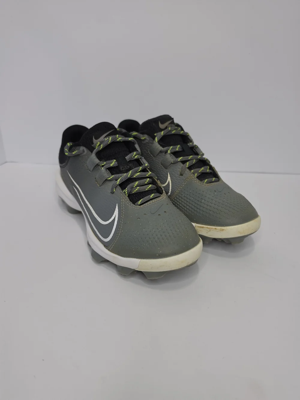 Nike Women’s Gray Athletic Cleats with White Swoosh and Neon Yellow Lace Accents